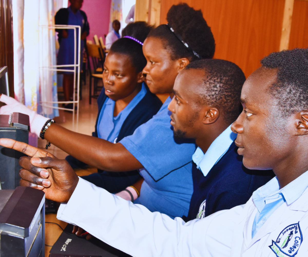Health sciences students working with laboratory information systems